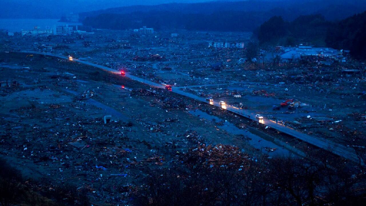 Vehicles pass through the ruins of the leveled city of Minamisanriku, Miyagi Prefecture, northeastern Japan on March 15, 2011, four days after the Tsunami devastated the area. (Image: AP)