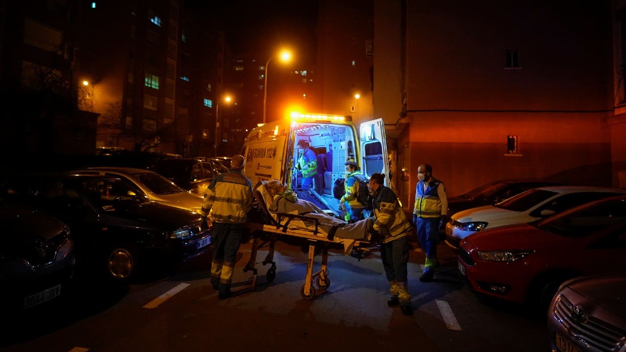 Madrid Emergency Service (SUMMA) UVI-4 unit's workers transfer a patient in a wheelchair during the coronavirus disease (COVID-19) outbreak in Madrid, Spain, February 9. (Image: Reuters)