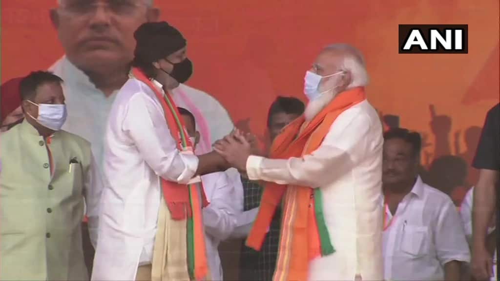 Prime Minsiter Narendra Modi meets Actor Mithun Chakroborthy, who today joins BJP. (ANI)