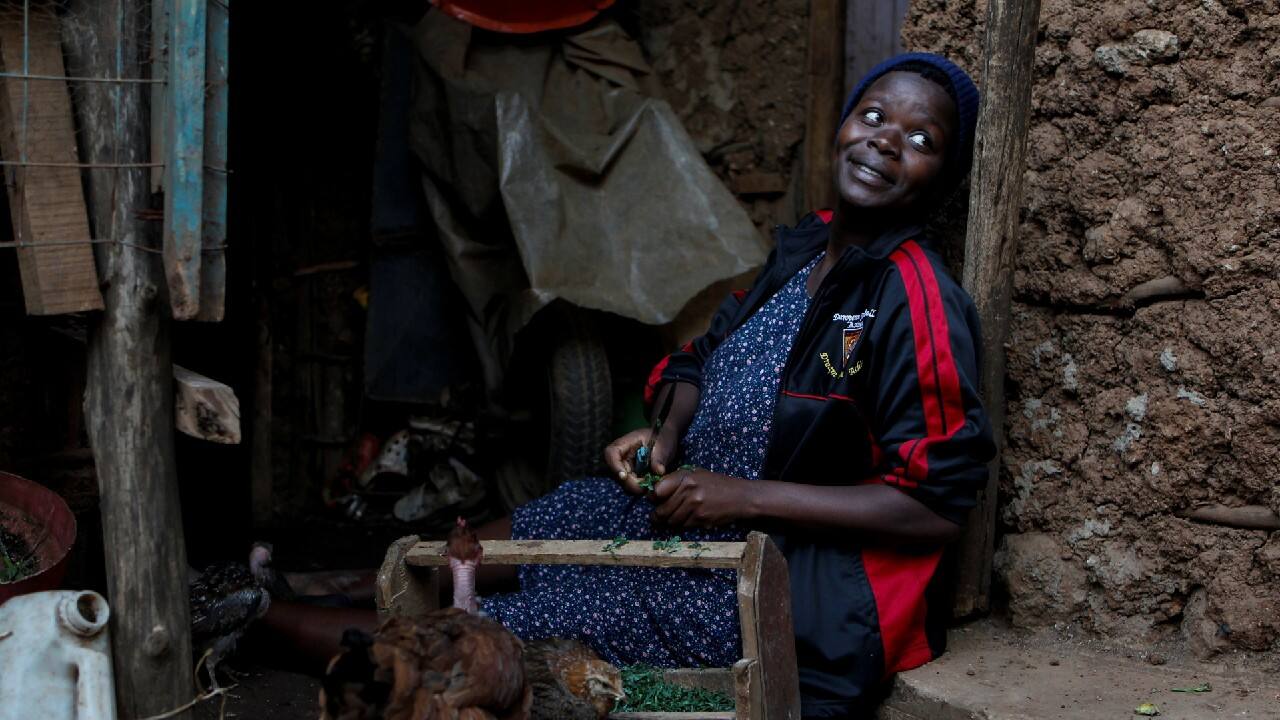 Secondary school student Jackline Bosibori, 17, who is nine months pregnant, sits outside her home with her family's hen in Lindi village within the Kibera slums in Nairobi, Kenya, November 4, 2020. Many Kenyan advocacy groups fear adolescent pregnancies increased as girls were forced to stay home while parents still went to work. &quot;If I was in school, I could have not been pregnant,&quot; she said. For Bosibori, school closures have made her dream of becoming a lawyer seem far away. &quot;I feel I have not progressed in any way this year,&quot; laments Bosibori. &quot;If I was in school, I could have improved in my goals.&quot; (Image: Reuters)