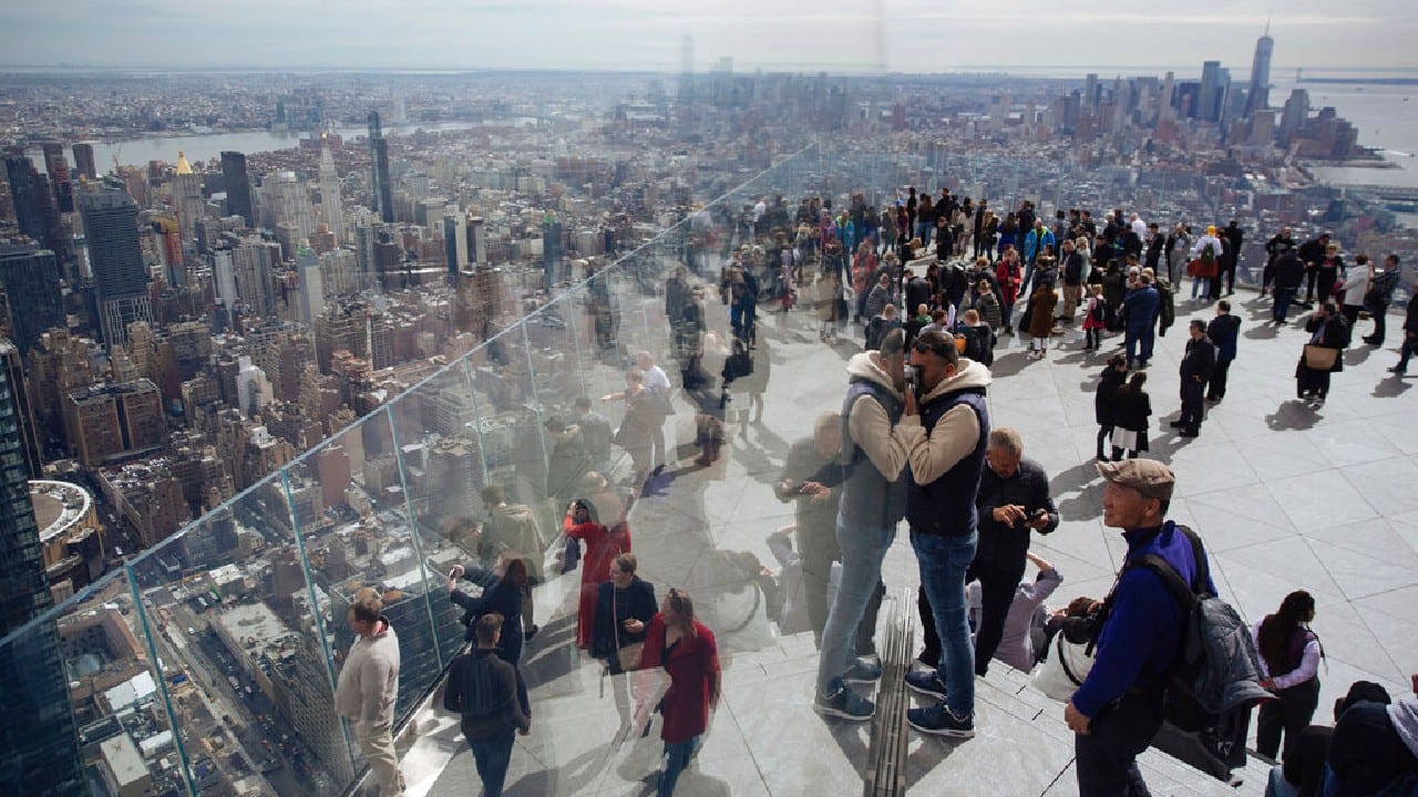 Tourists take in the view from the Edge, the new observation deck on the 100th floor of 30 Hudson Yards in New York on March 11, 2020. Edge is touted as the Western Hemisphere's highest outdoor sky deck. (Image: AP)