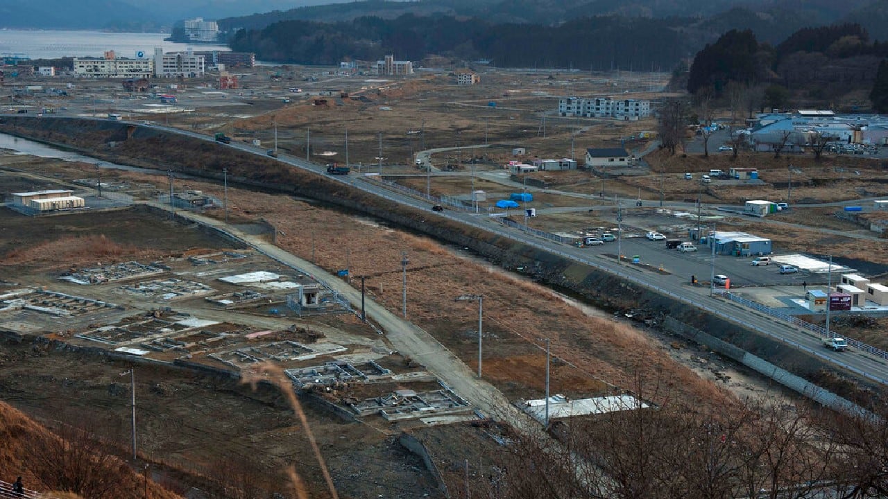 On February 23, 2012, vehicles pass through the ruins of the leveled city of Minamisanriku, Miyagi Prefecture, northern Japan, almost one year after the March 11, 2011 tsunami. (Image: AP)