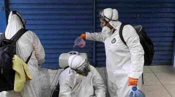 Volunteers fill a tank as they disinfect the alleys of Santa Marta slum during the coronavirus disease (COVID-19) outbreak, in Rio de Janeiro, Brazil. (Representative image: Reuters)