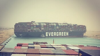 The Ever Given container ship stuck and blocking the Suez Canal as seen from another ship. Image courtesy: Julianne Cona (@fallenhearts17) on Instagram