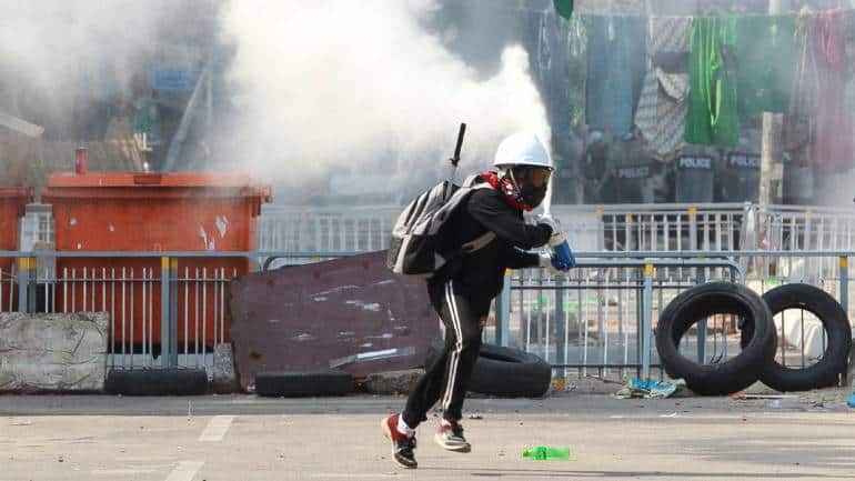 The Myanmar military overthrew Aung San Suu Kyi’s elected government in a coup on February 1. Protests against the coup continue, with more than 60 killed and 1,900 people arrested since the coup, Reuters reported citing the Assistance Association for Political Prisoners. In this image, an anti-coup demonstrator sprays a fire extinguisher as he runs away from a barricade during a protest in Yangon on March 9, 2021. (Image: Reuters/Stringer) The Myanmar military overthrew Aung San Suu Kyi’s elected government in a coup on February 1. Protests against the coup continue, with more than 60 killed and 1,900 people arrested since the coup, Reuters reported citing the Assistance Association for Political Prisoners. In this image, an anti-coup demonstrator sprays a fire extinguisher as he runs away from a barricade during a protest in Yangon on March 9, 2021. (Image: Reuters/Stringer)
