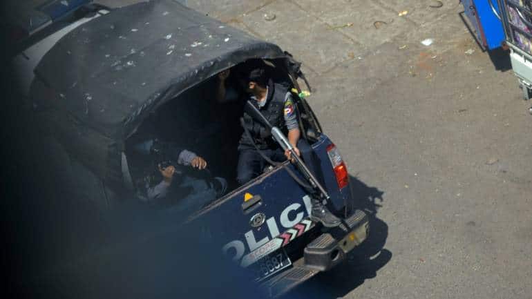 A police vehicle drives past after they seized Sanchaung district in search of anti-coup demonstrators in Yangon, Myanmar, on March 8. (Image: Reuters/Stringer)