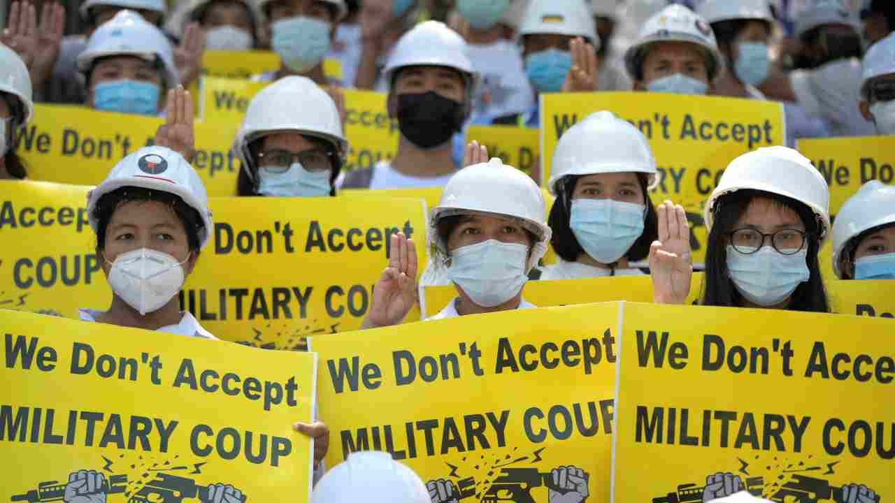 Demonstrators hold placards as they rally against the military coup in Yangon, Myanmar. (Image: Reuters)