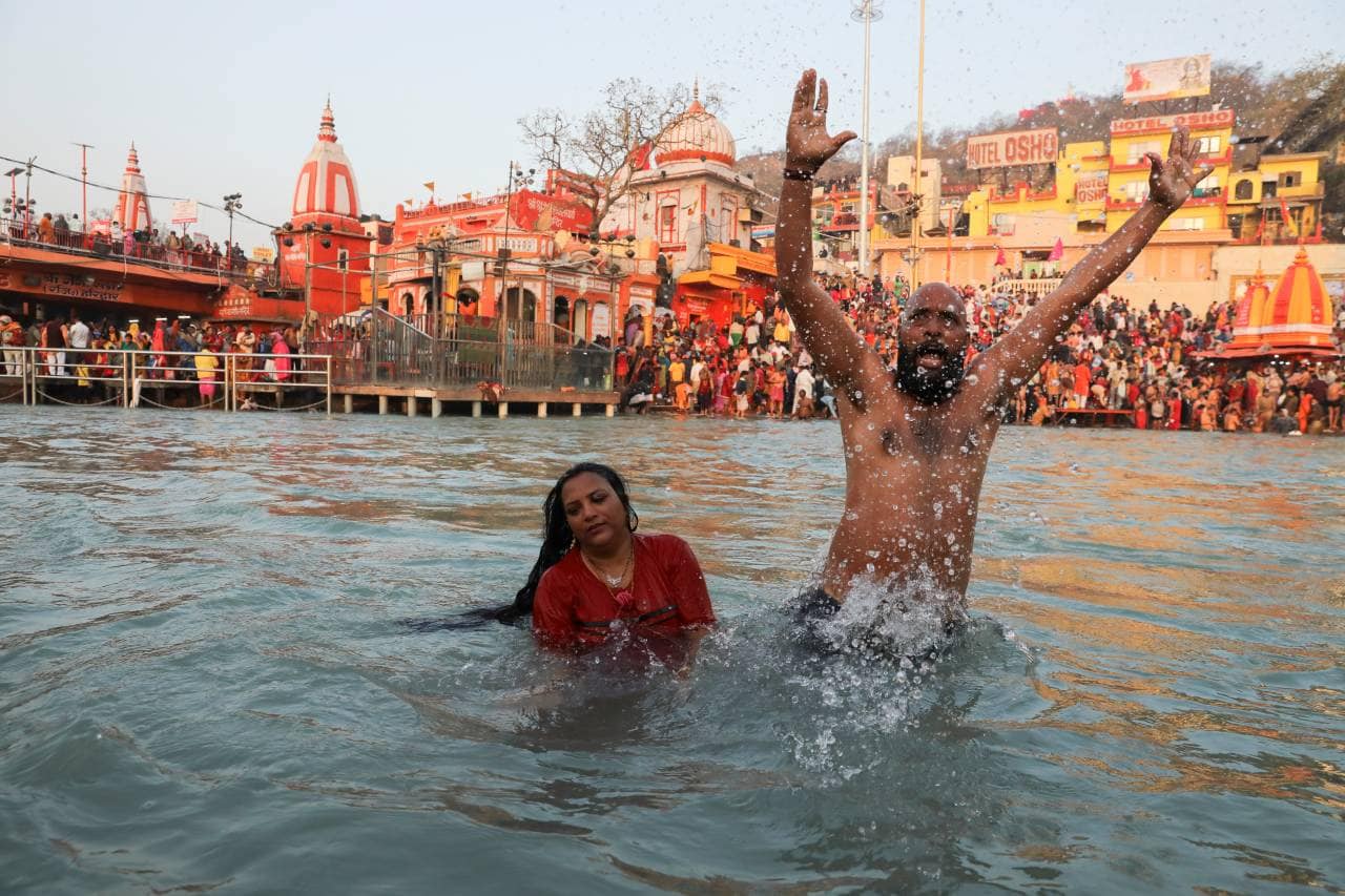 In Pics First Shahi Snan Of Kumbh Mela Thousands Of Devotees Take Dip In Holy Ganga 