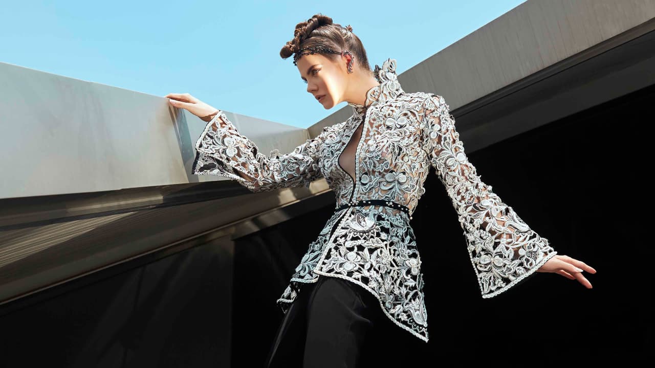 A model posing for Sania Maskatiya's outfit. 