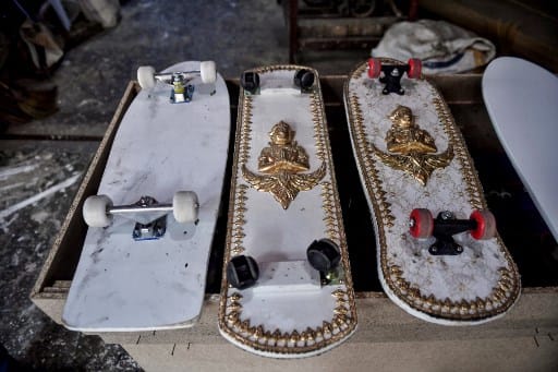 From a final resting place for the dead to a gnarly way to land a trick; a Thai coffin-maker is affixing Buddhist emblems to the dismantled walls of his caskets, and transforming them into skateboards. This image shows skateboards, made from wood used for coffins, at the Burapha coffin shop in Bangkok. (Image: AFP)
