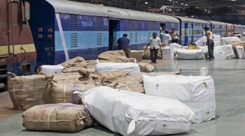 Cargo being loaded by porters on to an early morning train to Ahmedabad at CSMT in Mumbai (Image: Shutterstock)