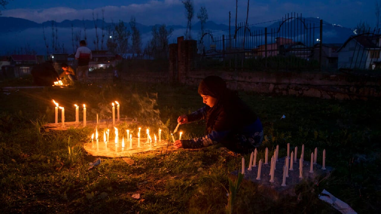 These and more are among the AP’s top faith-related images from March. A Kashmiri Shiite Muslim girl lights candles at the grave of her relative to mark Shab-e- Barat, on the outskirts of Srinagar. Muslims visit ancestral graveyards for the salvation of the souls of the departed and also believe that all sins will be forgiven by praying to Allah throughout the Shab-e Barat night. (Image: AP) These and more are among the AP’s top faith-related images from March. A Kashmiri Shiite Muslim girl lights candles at the grave of her relative to mark Shab-e- Barat, on the outskirts of Srinagar. Muslims visit ancestral graveyards for the salvation of the souls of the departed and also believe that all sins will be forgiven by praying to Allah throughout the Shab-e Barat night. (Image: AP)