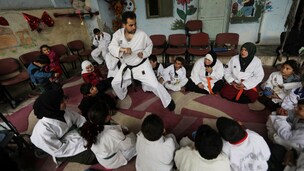 A karate instructor, displaced by war trains kids in Syrian town