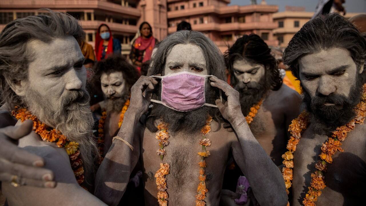 A Naga Sadhu, or Hindu holy man wears a mask before the procession for taking a dip in the Ganges river during Shahi Snan at &quot;Kumbh Mela&quot;, or the Pitcher Festival, amidst the spread of the COVID-19, in Haridwar, India, April 12. (Image: Reuters)