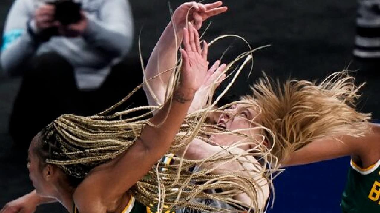 Baylor's DiJonai Carrington shoots past UConn's Paige Bueckers during the second half of an NCAA college basketball game in the Elite Eight round of the Women's NCAA tournament on March 29, 2021, at the Alamodome in San Antonio. (Image: AP)