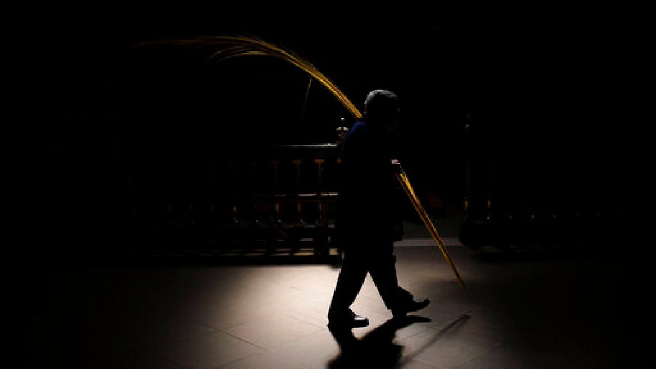 A worshipper takes part in a Holy Week Palm Sunday procession at Saint Mary cathedral, in Pamplona, northern Spain, March 28. Many devotees attended the procession a year after events were cancelled due to the outbreak of the coronavirus pandemic. (Image: AP)