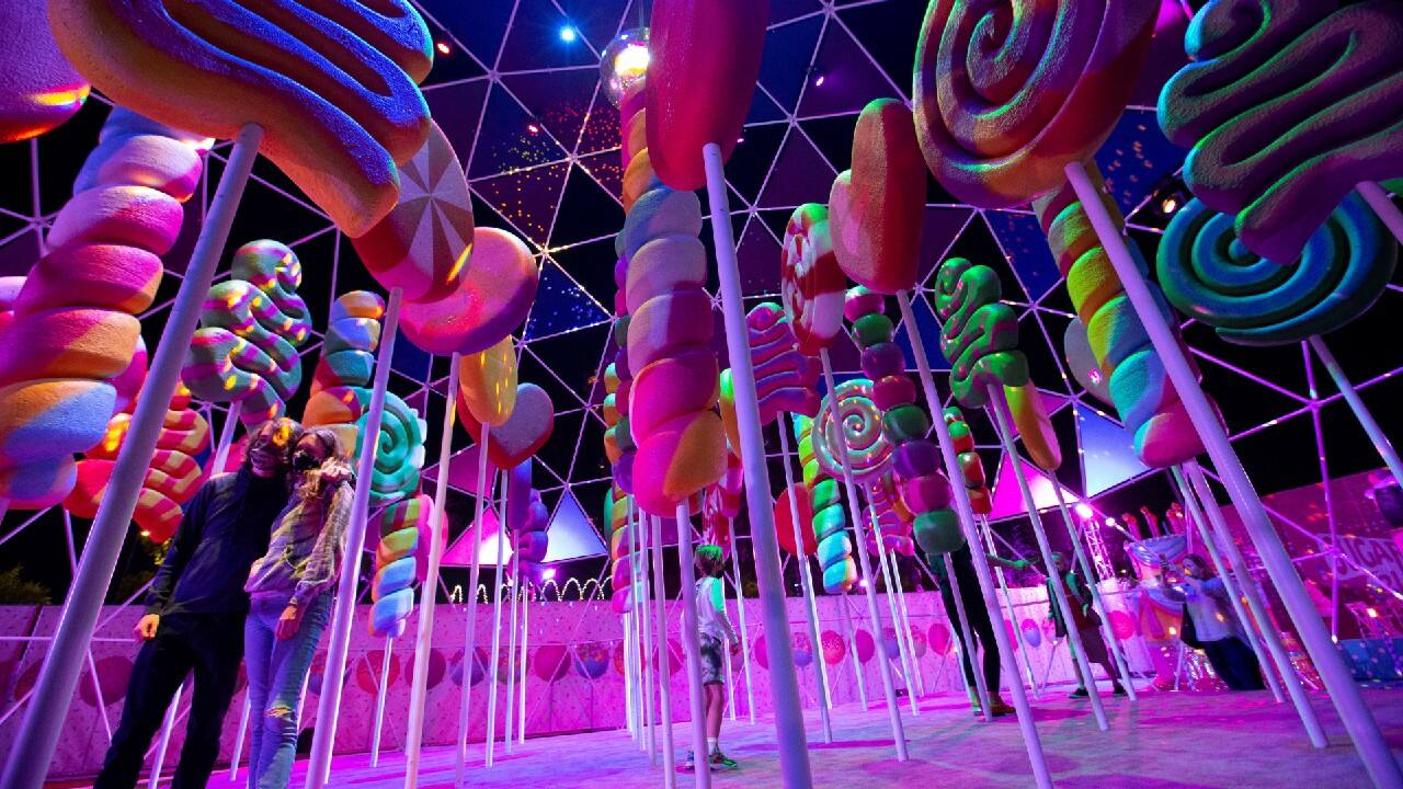 Guests pose for photos by an installation at the &quot;Sugar Rush&quot; experience, a candy-based theme park, in Woodland Hills, California, U.S. (Image: Reuters)