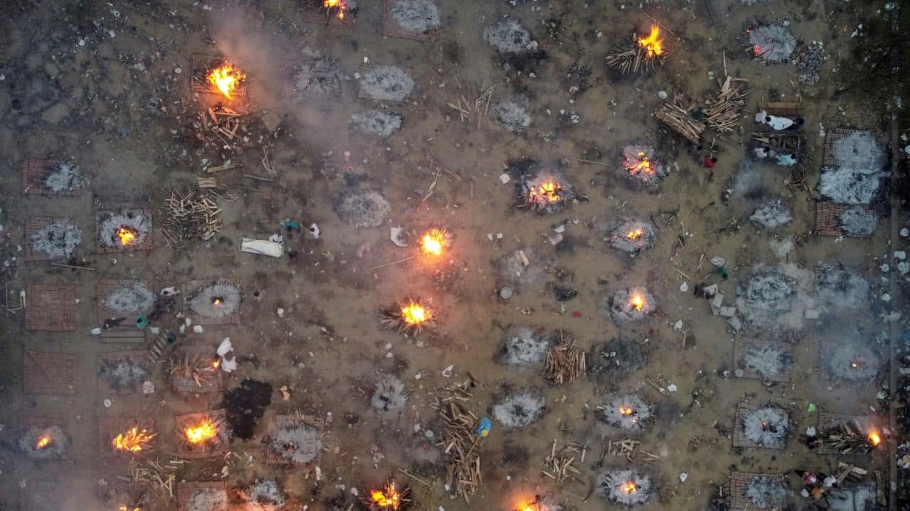 A mass cremation of victims who died due to the coronavirus disease (COVID-19), is seen at a crematorium ground in New Delhi, India. Picture taken with a drone. (Image: REUTERS/Danish Siddiqui)