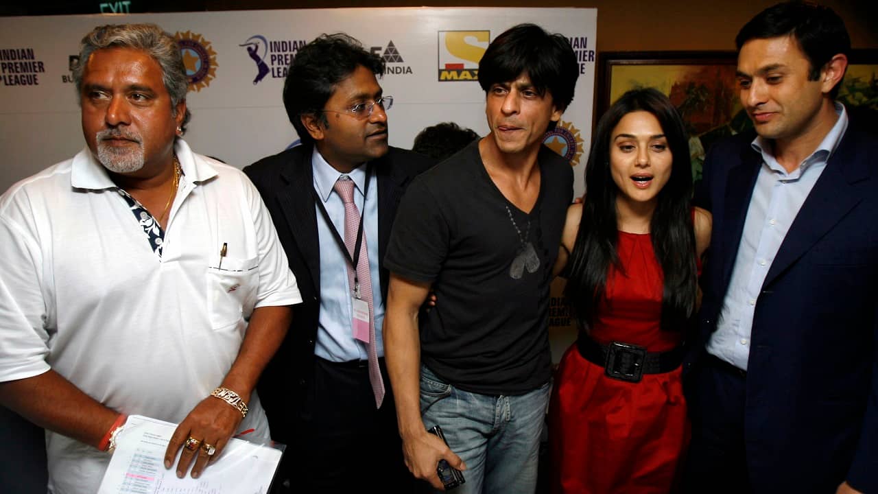 Industrialists Vijay Mallya (left), Ness Wadia (right), IPL founder Lalit Modi (second from left) and Bollywood actors Shah Rukh Khan (center) and Preity Zinta pose during a news conference after the first player auction in Mumbai, Maharashtra on February 20, 2008. (Image: Reuters/Punit Paranjpe)