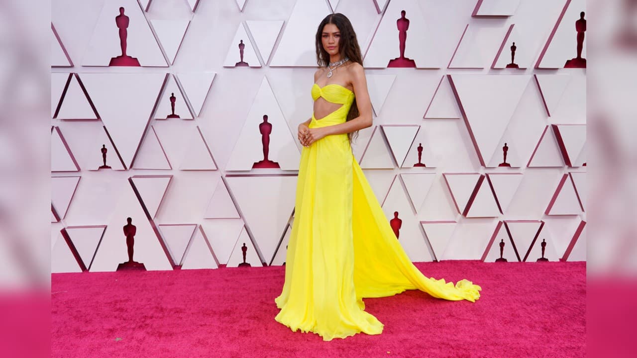 Zendaya made the appearance at the Los Angeles ceremony in standout yellow by Valentino and Bulgari diamonds from ears and neck to her fingers. (Image: AP)