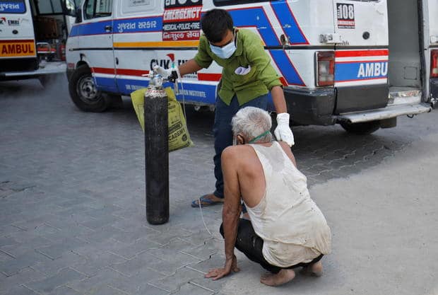 A patient with a breathing problem is helped by a relative to enter a COVID-19 hospital for treatment in Ahmedabad, India, April 19, 2021. AMIT DAVE/REUTERS A patient with a breathing problem is helped by a relative to enter a COVID-19 hospital for treatment in Ahmedabad, India, April 19, 2021. AMIT DAVE/REUTERS