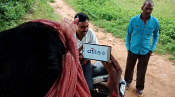 man hand showing Citibank logo on smart phone at agriculture green field district Katni Madhya Pradesh in India shot captured on sep 2019
Editorial credit: NEERAZ CHATURVEDI / Shutterstock.com

