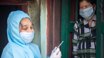 In villages across India, frontline workers are going door to door and convincing people to take the Covid-19 vaccine. (Shutterstock)