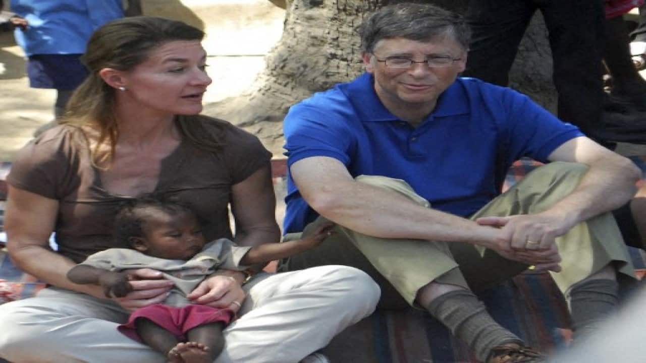 In this file photo taken on March 23, 2011 Microsoft founder and philanthropist Bill Gates (R) looks on as his wife Melinda holds a toddler during their visit to a village at Patna district in India's Bihar's state. Bill Gates, the Microsoft founder-turned philanthropist, and his wife Melinda are divorcing after a 27-year-marriage, the couple said in a joint statement Monday. The announcement from one of the world's wealthiest couples, with an estimated net worth of some $130 billion, was made on Twitter. (Image: AFP)