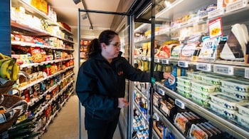 Store manager Domenica Gerlach works in the Lifvs unmanned supermarket store in Veckholm, a village of a few hundred people, about 80 kilometres from Stockholm, on May 6, 2021, near the city of Enkoping. (Image: Jonathan Nackstrand/AFP)
