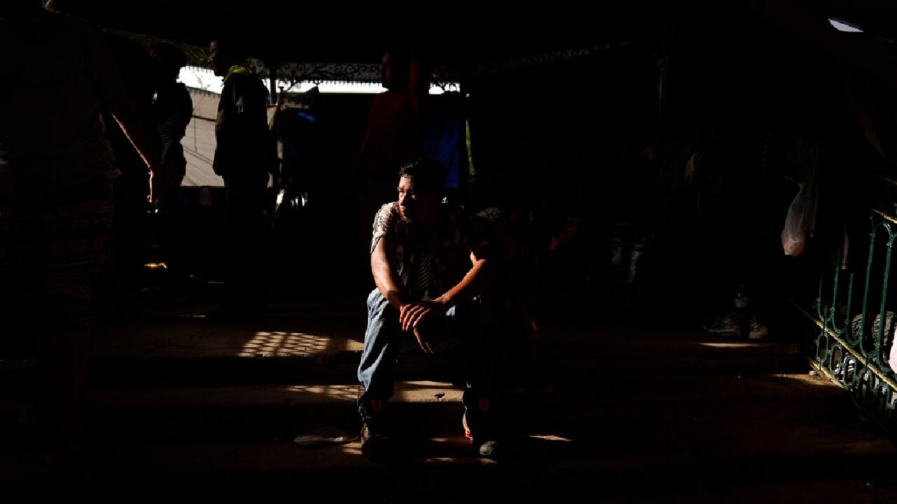 A man from Honduras sits at a makeshift camp for migrants, May 14, in Reynosa, Mexico, just blocks from the U.S.-Mexico border. The man had been released to Mexico after trying to cross into the U.S., and said he now plans to return to Honduras. (Image: AP/Gregory Bull)