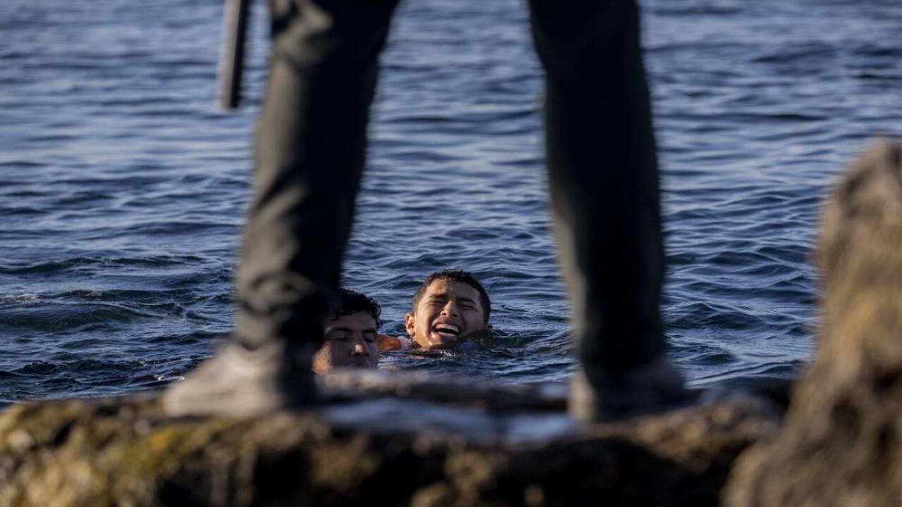 A Spanish civil guard wait for migrants to arrive at the Spanish enclave of Ceuta, near the border of Morocco and Spain, Wednesday, May 19, 2021. Spanish officials are acknowledging for the first time that the unprecedented migrant crisis has been triggered by an angry Rabat at Madrid's decision to provide medical treatment to the militant boss of the Polisario Front. (Image: AP)