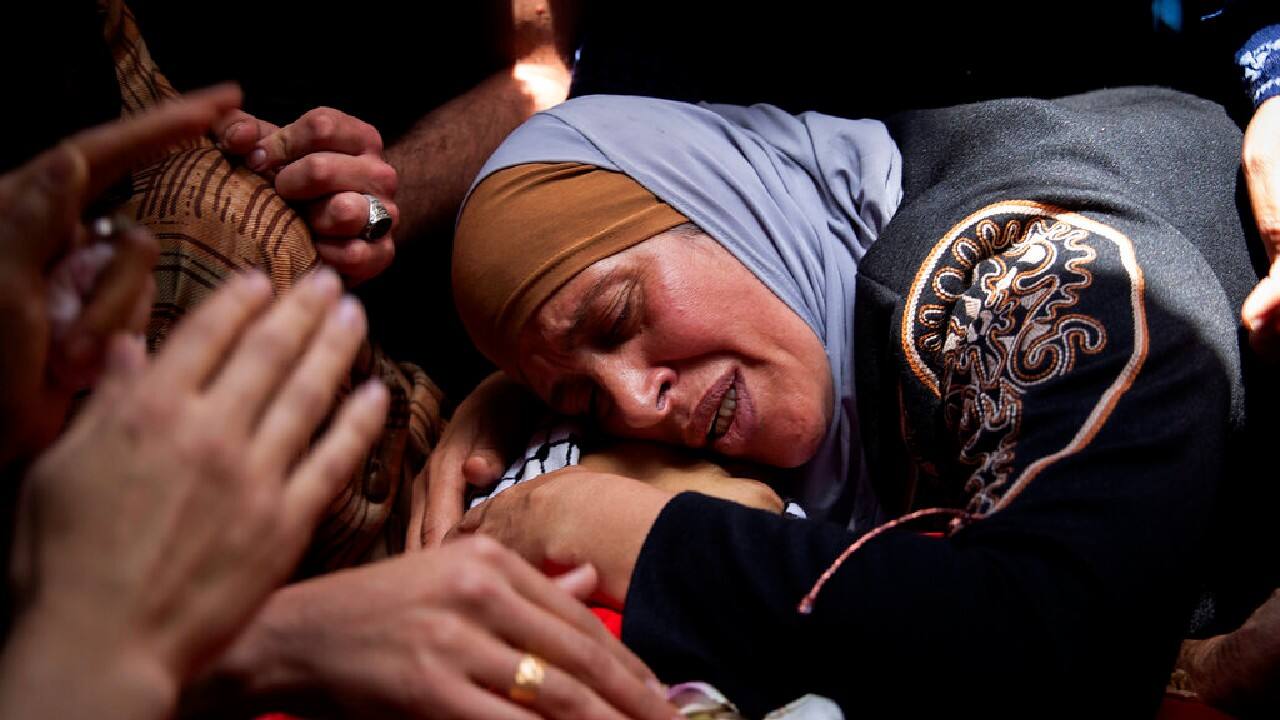 A Palestinian woman mourns over her son, Rasheed Abu Arra, who was killed in clashes with Israeli forces, during his funeral in the Village of Aqqaba near the West Bank town of Tubas, May 12. (Image: AP/Majdi Mohammed)