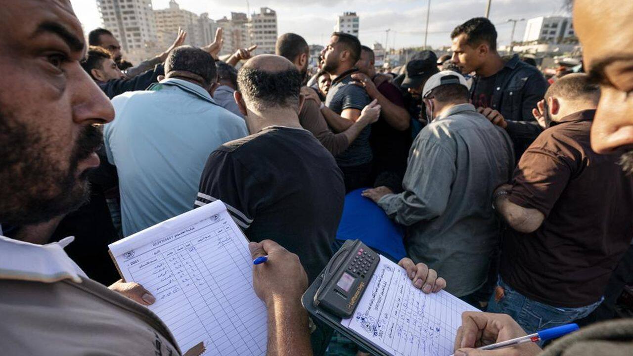 Recorders take down winning bids on fish lots as the day's catch is sold at auction after a limited number of boats were allowed to return to the sea following a cease-fire reached after an 11-day war between Hamas and Israel, in Gaza City, Sunday, May 23, 2021. (AP Photo/John Minchillo) Recorders take down winning bids on fish lots as the day's catch is sold at auction after a limited number of boats were allowed to return to the sea following a cease-fire reached after an 11-day war between Hamas and Israel, in Gaza City, Sunday, May 23, 2021. (AP Photo/John Minchillo)