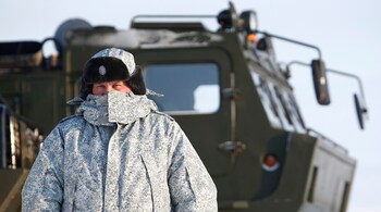 A Russian serviceman stands in front of an off-road military vehicle at the Nagurskoye military base in Alexandra Land on the remote Arctic islands of Franz Josef Land, Russia on March 29, 2017 (File image: Reuters/Sergei Karpukhin)