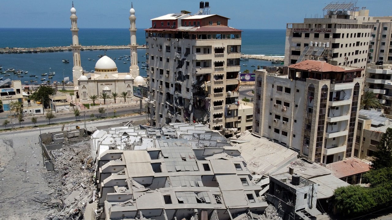A picture taken with a drone shows the remains of a tower building which was destroyed in Israeli air strikes in Gaza City May 12, 2021. (Image: Reuters/Mohammed Salem)