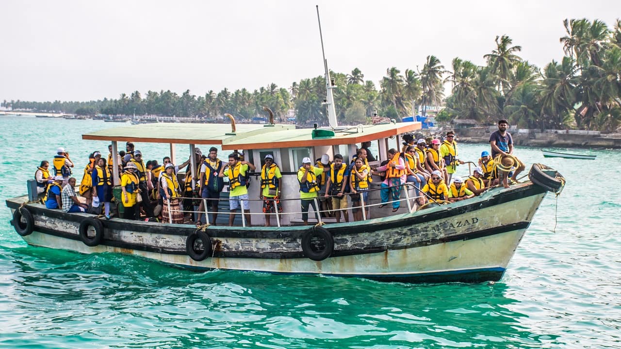 Tourists transferring to Minicoy Island, Lakshadweep in boat (Image: sixpixx/Shutterstock)