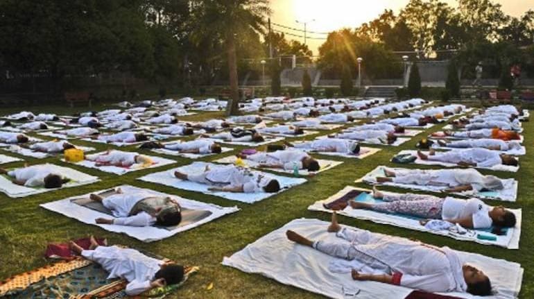 A 2020 analysis found that yoga generally improves physical function, quality of life and pain for many people with knee pain, neck pain, headaches and low back pain. But, the review said, relief is often slight and some participants wind up reporting more pain after they take up yoga. (Image: Narinder Nanu/AFP) , How to exercise with chronic pain, The World Live Breaking News Coverage & Updates IN ENGLISH