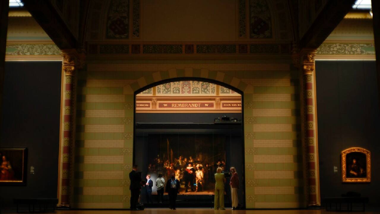 The printed strips now hang flush to the edges of the 1642 painting in the museum's Honor Gallery. Their addition restores to the work the off-center focal point that that rebellious Golden Age master Rembrandt originally intended. (Image: AP) The printed strips now hang flush to the edges of the 1642 painting in the museum's Honor Gallery. Their addition restores to the work the off-center focal point that that rebellious Golden Age master Rembrandt originally intended. (Image: AP)