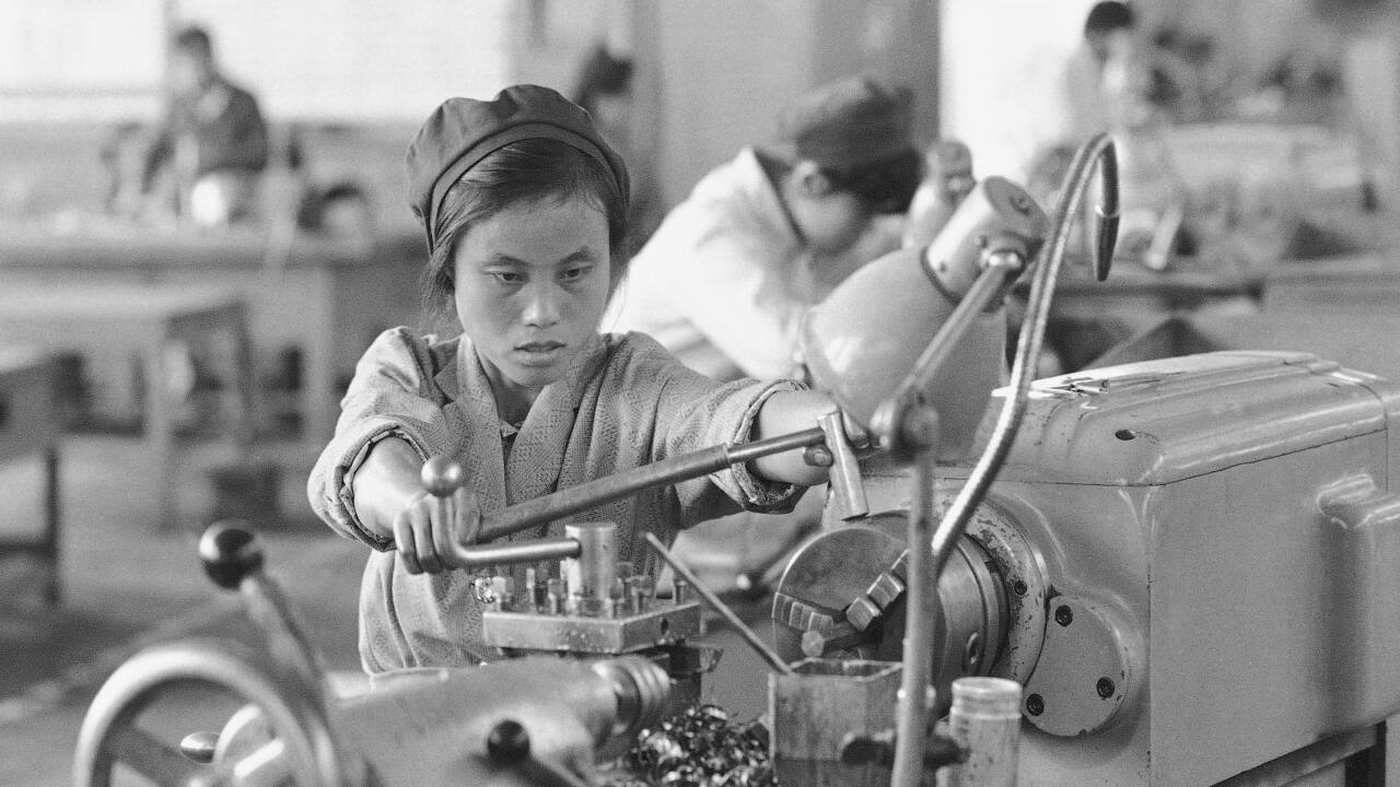 In this northwest China precision valve factory, shown Sept. 9, 1985, many of the machinists are women in Wuzhong, China. The late Chinese leader Mao Zedong made improvements of women's issues a major goal, but despite improvements women still face difficulties at all levels. (AP Photo/Neal Ulevich)