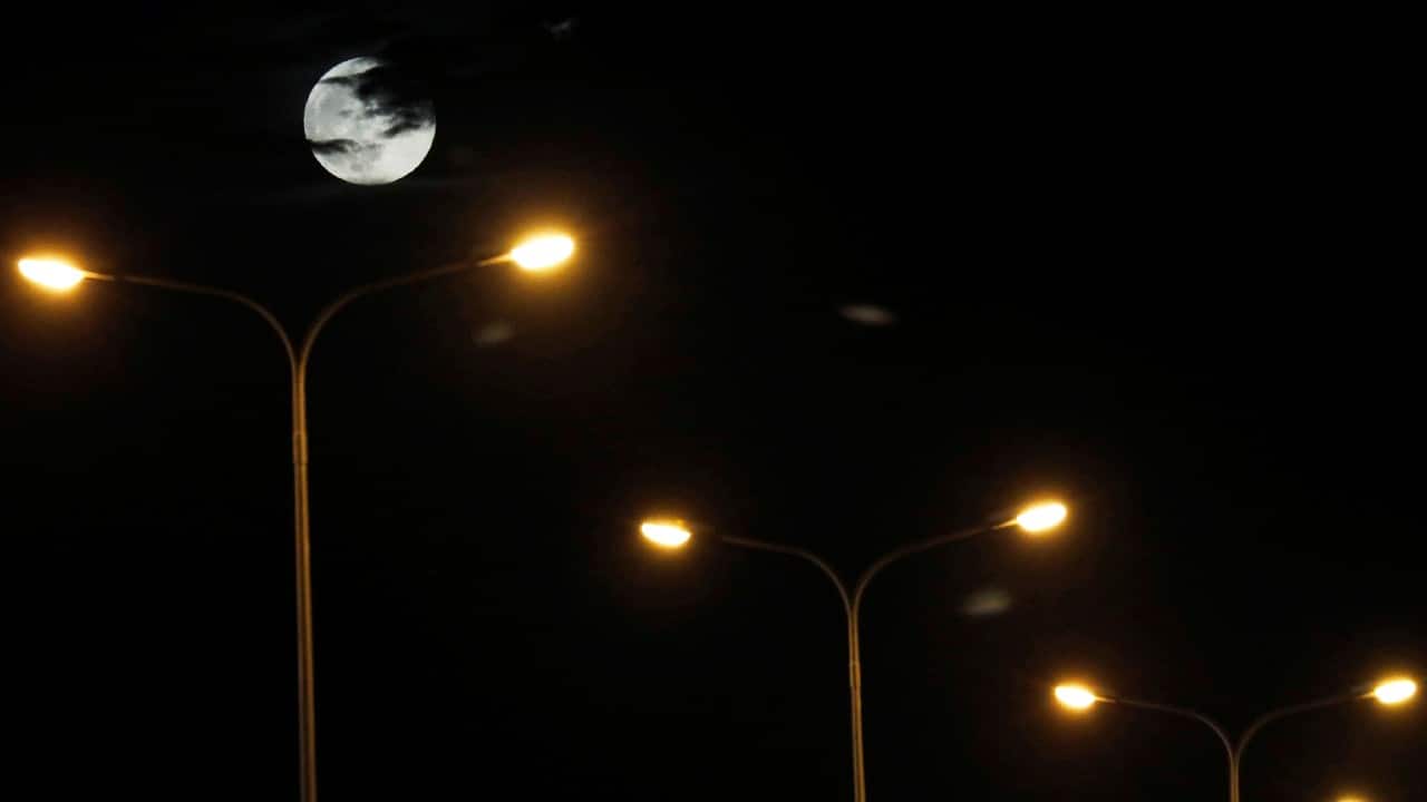 The strawberry full moon is seen in Tirana, Albania, June 24. (Image: Reuters)