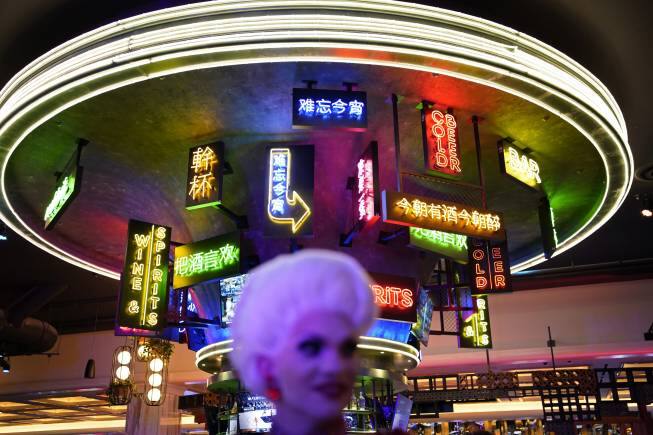 People attend a party during the the opening night of the Resorts World Las Vegas hotel-casino, Thursday, June 24, 2021, in Las Vegas. (AP Photo/John Locher)