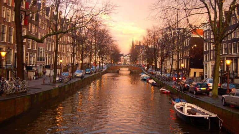 Amsterdam's iconic canals are a must-see for anyone visiting the city -  Holland.com