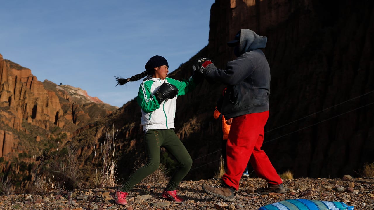 Gracce Kelly Flores, a 12-year-old boxer who goes by the nickname Hands of Stone, does her daily boxing workout as she trains with her father Alberto Flores in Palca, Bolivia. (AP Photo/Juan Karita)