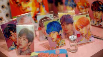 BTS merchandise on display at a pop-up store in Seoul, South Korea. A new exhibition at London's V&A looks beyond the growing international popularity of Korean cultural content over the last 25 years. (Image: Reuters)