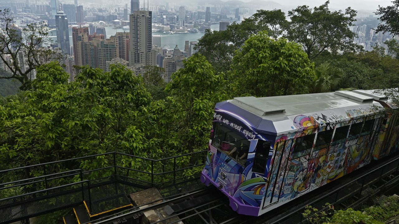 Hong Kong’s Peak Tram is a fixture in the memories of many residents and tourists, ferrying passengers up Victoria Peak for a bird’s eye view of the city’s many skyscrapers. (AP Photo/Vincent Yu)
