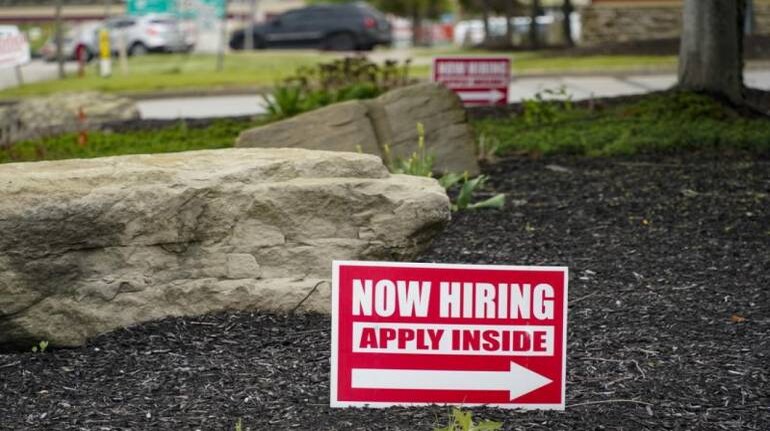 US applications for jobless benefits fall again as labor market