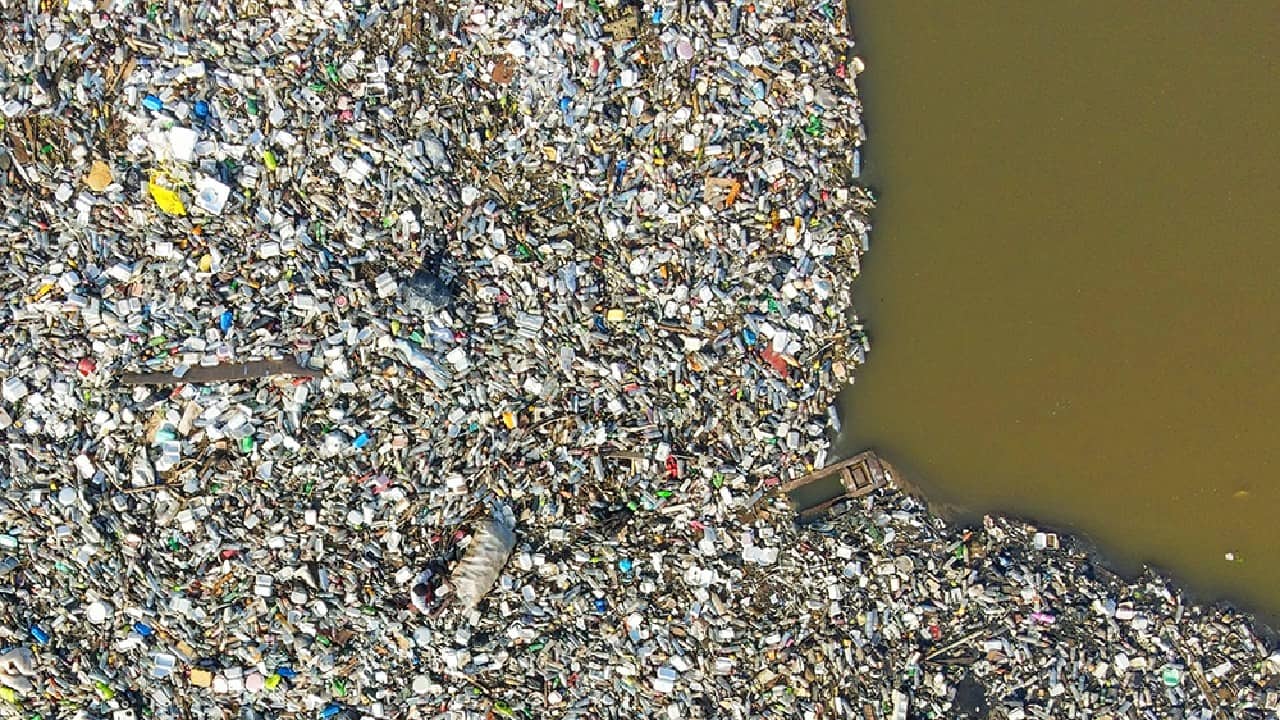Major drainage systems in Accra, Ghana's capital city, empty single-use plastic waste into the ocean through the Korle Lagoon. The urban poor sometimes swim in it to recover recyclable material. (Image: Muntaka Chasant (Ghana) via UN) Major drainage systems in Accra, Ghana's capital city, empty single-use plastic waste into the ocean through the Korle Lagoon. The urban poor sometimes swim in it to recover recyclable material. (Image: Muntaka Chasant (Ghana) via UN)