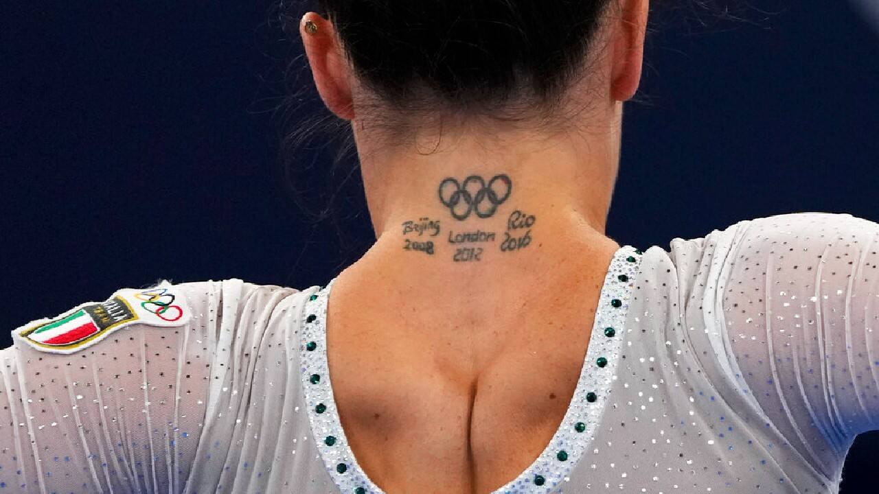 Italian gymnast Vanessa Ferrari has them, too, on the back of her neck — along with ink commemorating previous trips to the Beijing, London and Rio de Janiero Games. (Image: AP)