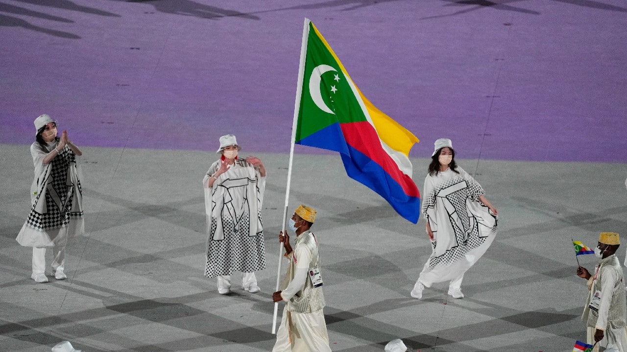 Fadane Hamadi, of Comoros, carries his country's flag during the opening ceremony in the Olympic Stadium at the 2020 Summer Olympics in Tokyo, Japan. (Image: AP)