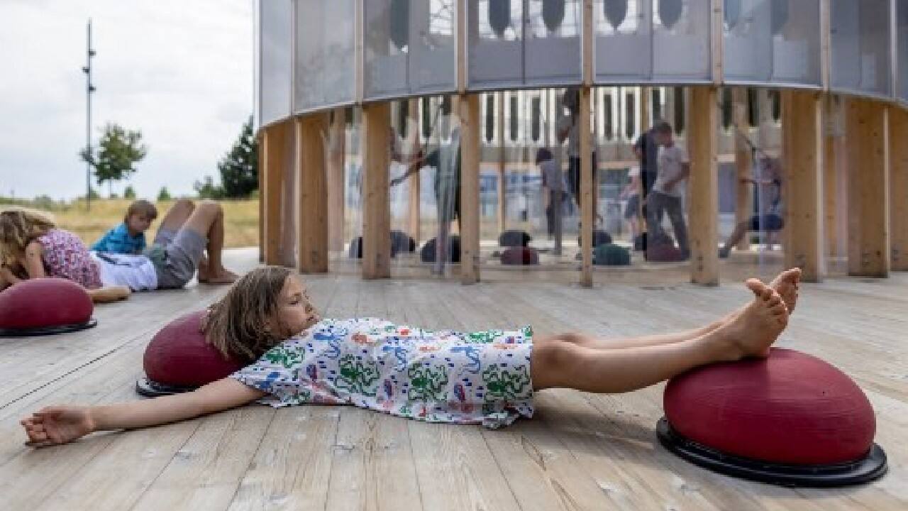 The small circular playground is located next to the riverside Copernicus Science Centre, which stations an employee there to answer any questions and make sure no one gets hurt. (Image: AFP)